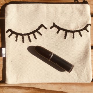 Many faces canvas utility purse.